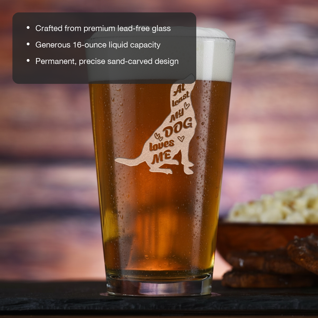 Dog Loves Me Personalized Pint Glass features showing premium lead-free glass, 16 oz capacity, and permanent sand-carved design