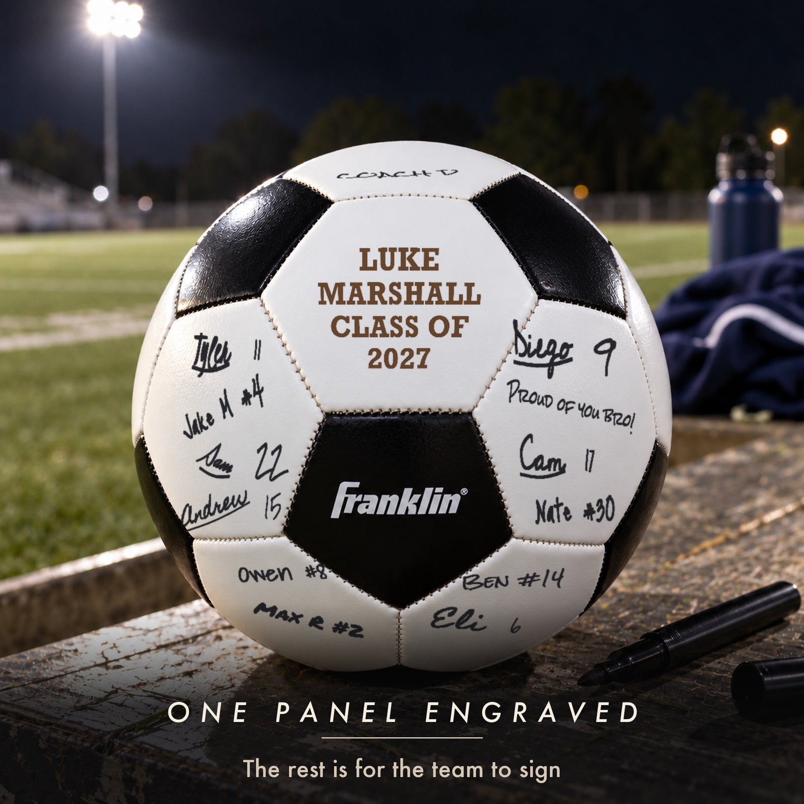 Senior night soccer ball with one engraved panel for Luke Marshall, Class of 2027, and teammates' marker signatures on every other panel, a soccer senior night gift