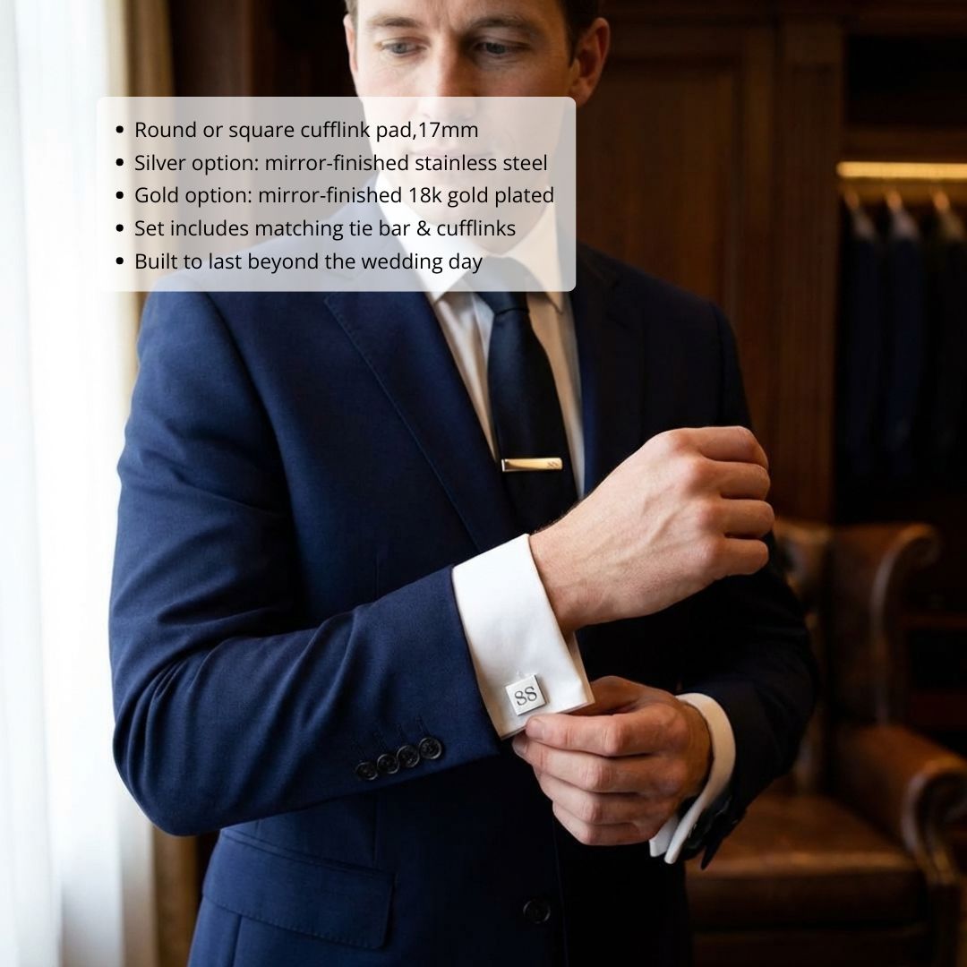 Man in navy suit and white dress shirt wearing square silver cufflinks with matching tie bar, shown in formal indoor setting