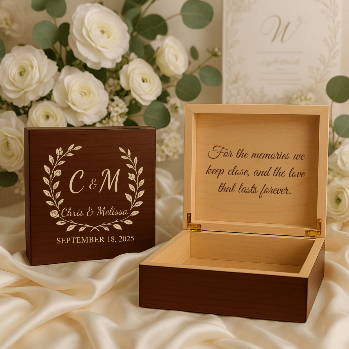 Elegant wedding keepsake box featuring engraved names and date with a romantic floral design, perfect for storing wedding mementos.
