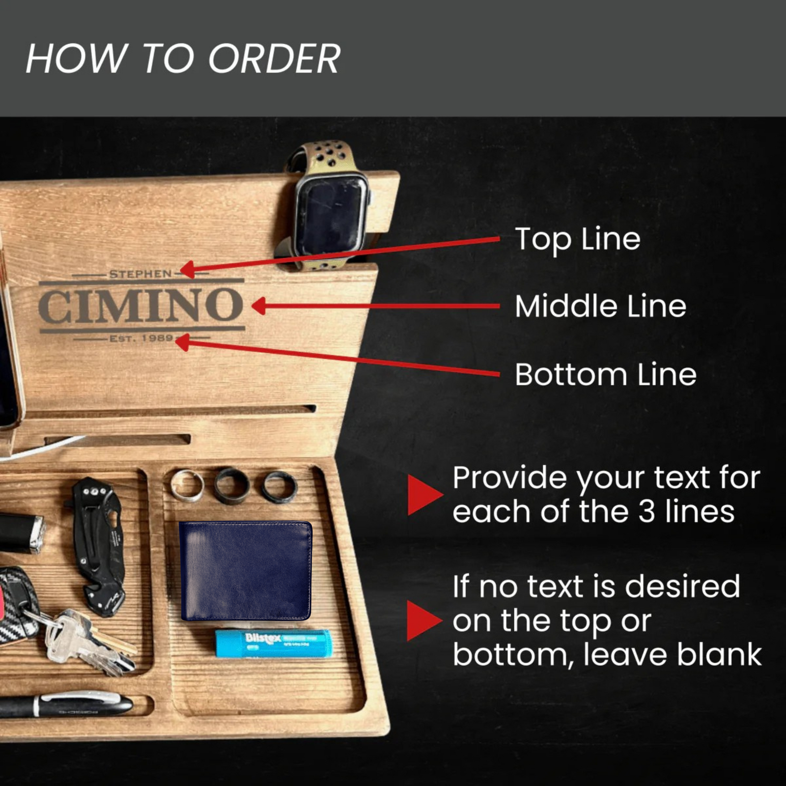 Wooden desk organizer with sample personalization showing three engraving lines: "STEPHEN" at top, "CIMINO" in middle, and "EST. 1989" at bottom, with arrow callouts explaining customization options