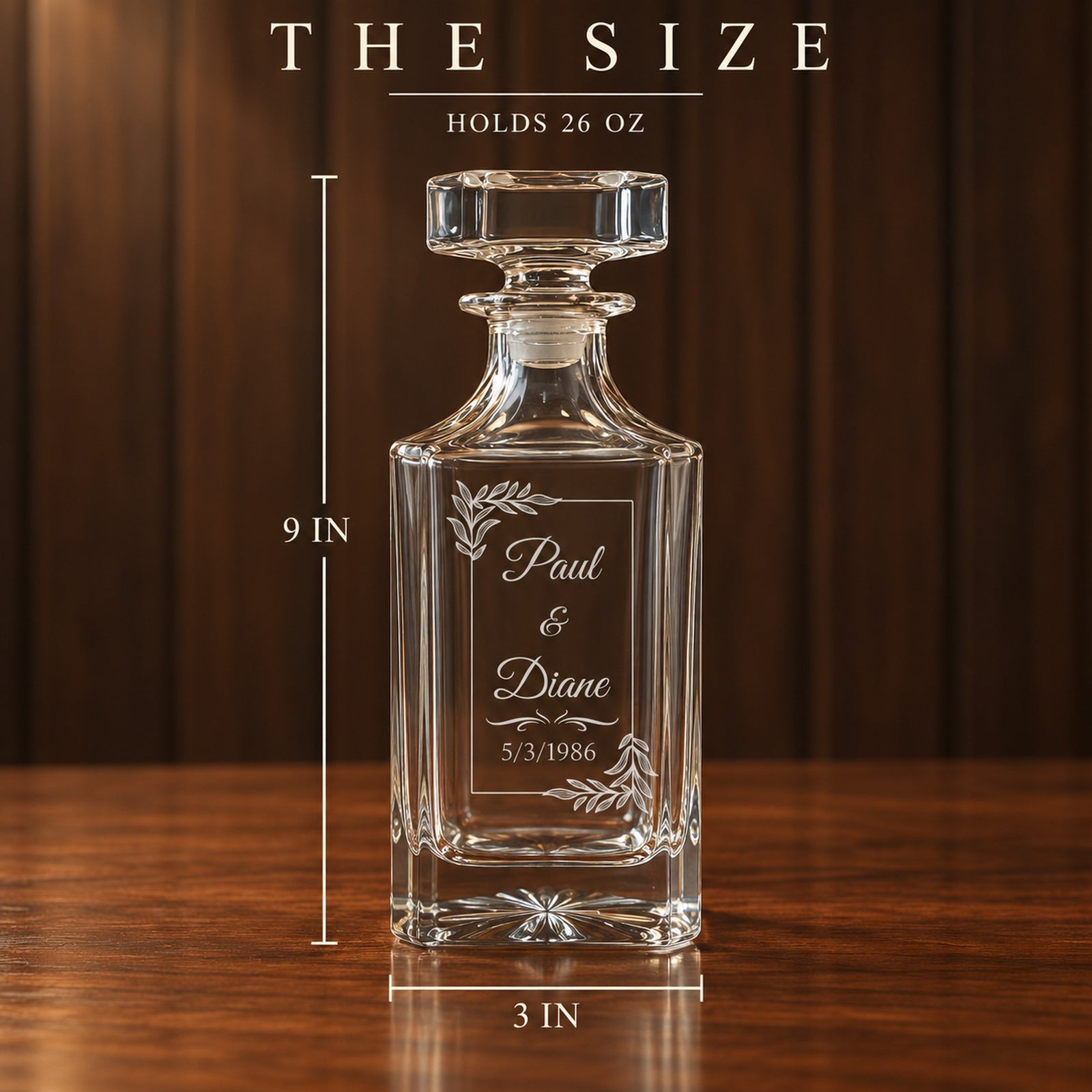 Size of the personalized whiskey decanter, 9 inches tall with a 3 inch base and holds 26 oz, engraved with a couple's names and 1986 wedding date