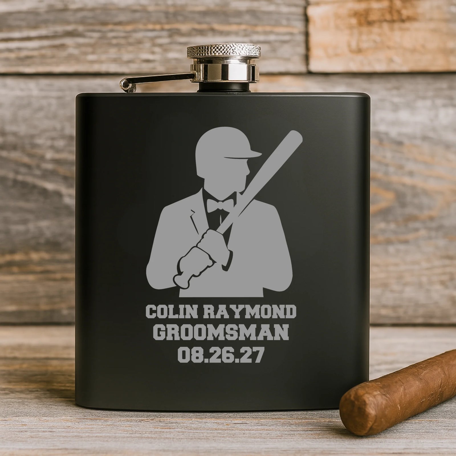 Matte black personalized groomsmen flask with engraved name, wedding role, date, and baseball silhouette design