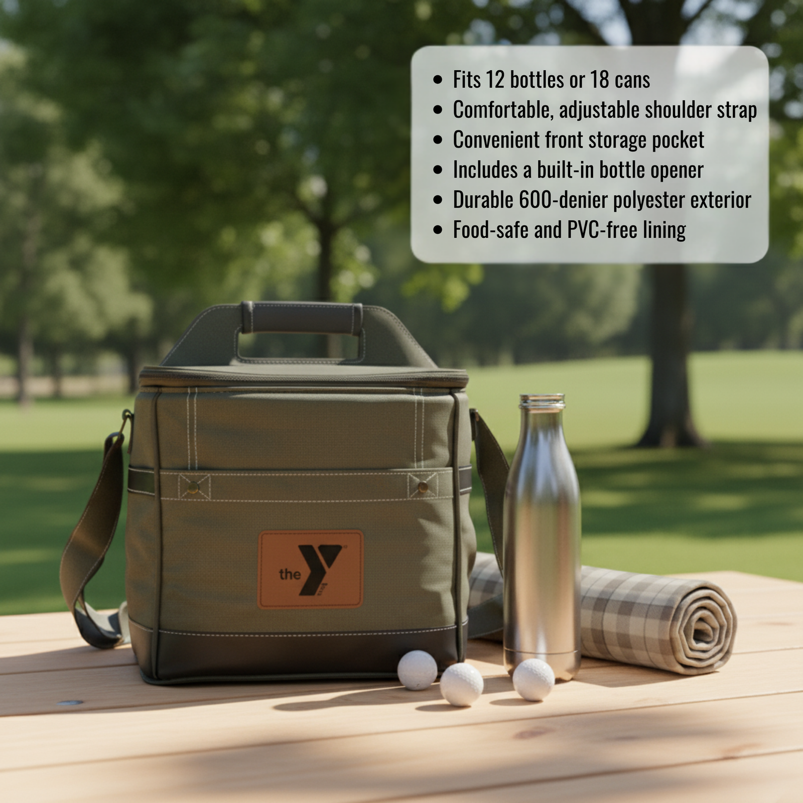 Tan insulated cooler bag with orange leather logo patch displayed outdoors with metal bottle, rolled towel, and golf balls on wooden table