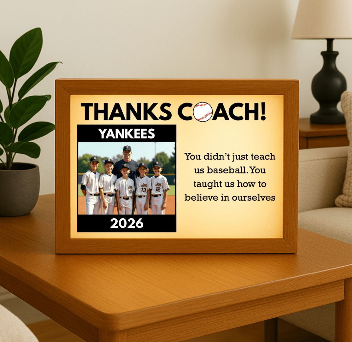 Framed picture with 'Thanks Coach!' text and a photo of a Yankees team on a wooden table. Baseball coach gift