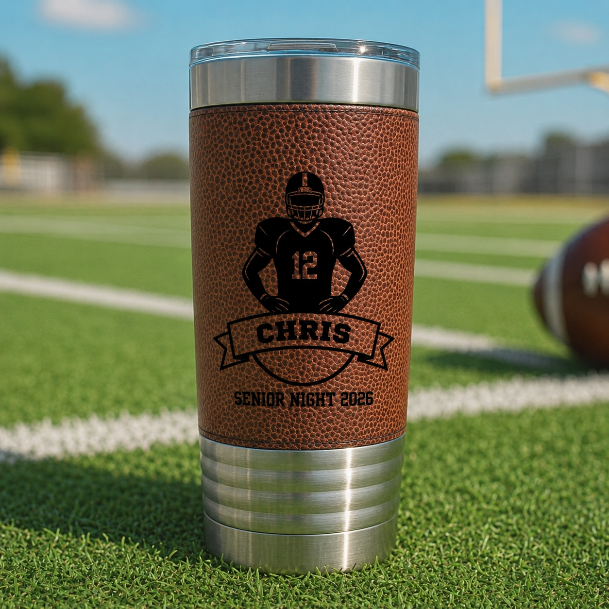 Tumbler with football design and text on a grassy field background