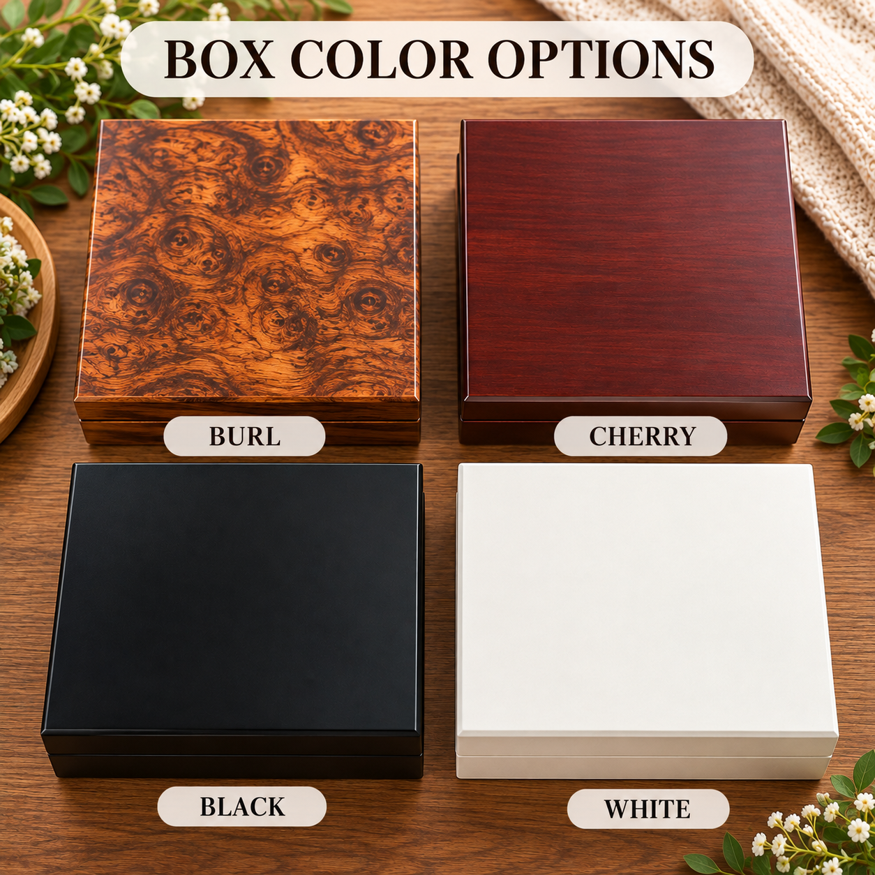 Four wood memory boxes shown in burl, cherry, black, and white finishes, arranged in a 2x2 grid on a natural wood surface with baby's breath flowers