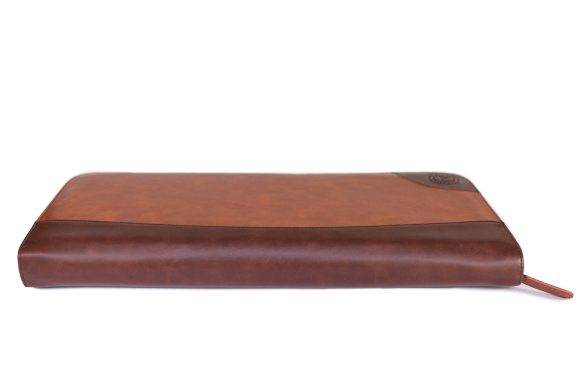 Brown vegan leather travel tie case with plush black interior, holds ties, cufflinks, and clips.