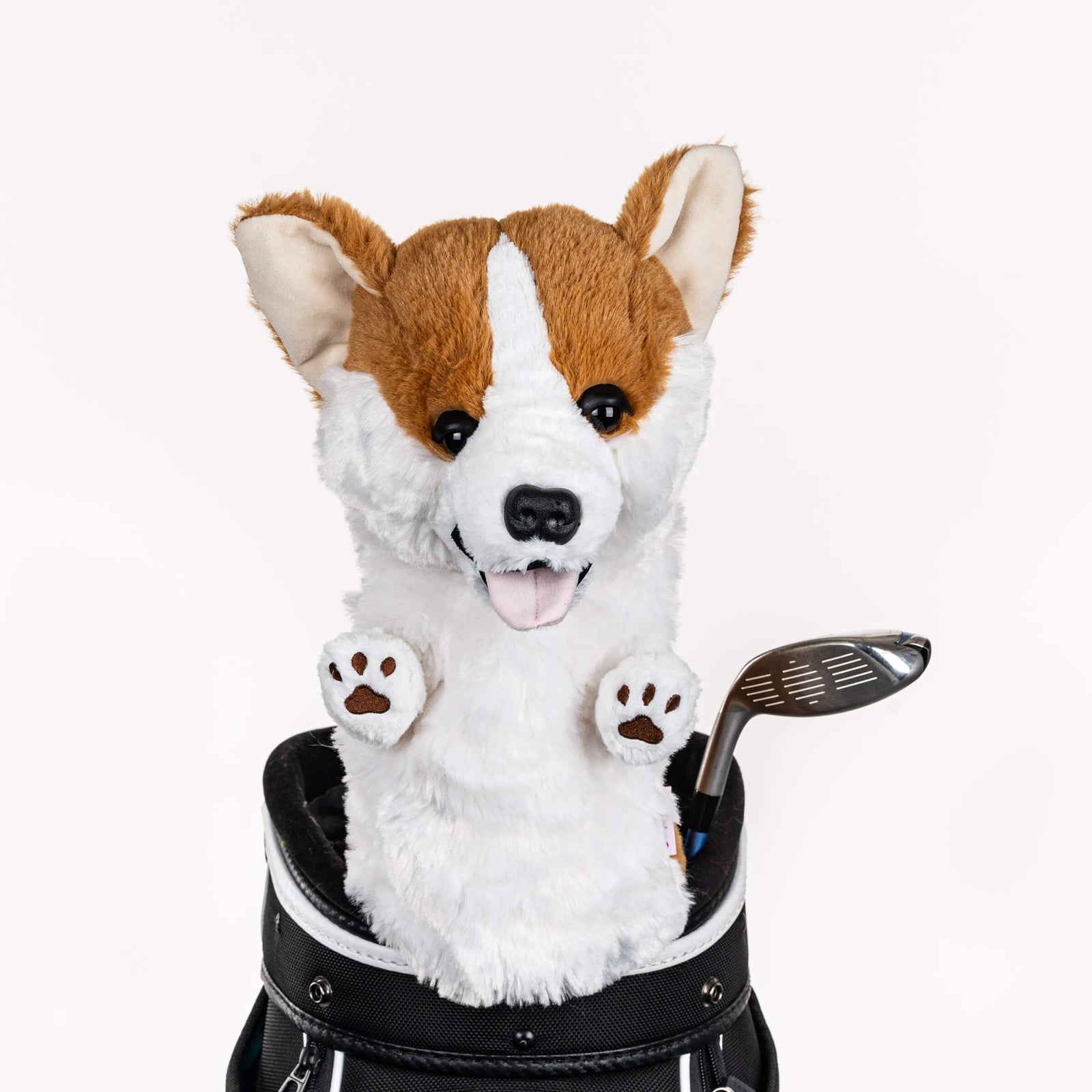 Plush corgi golf headcover covering a club in a golf bag, a standout golf gift for men from Groovy Guy Gifts