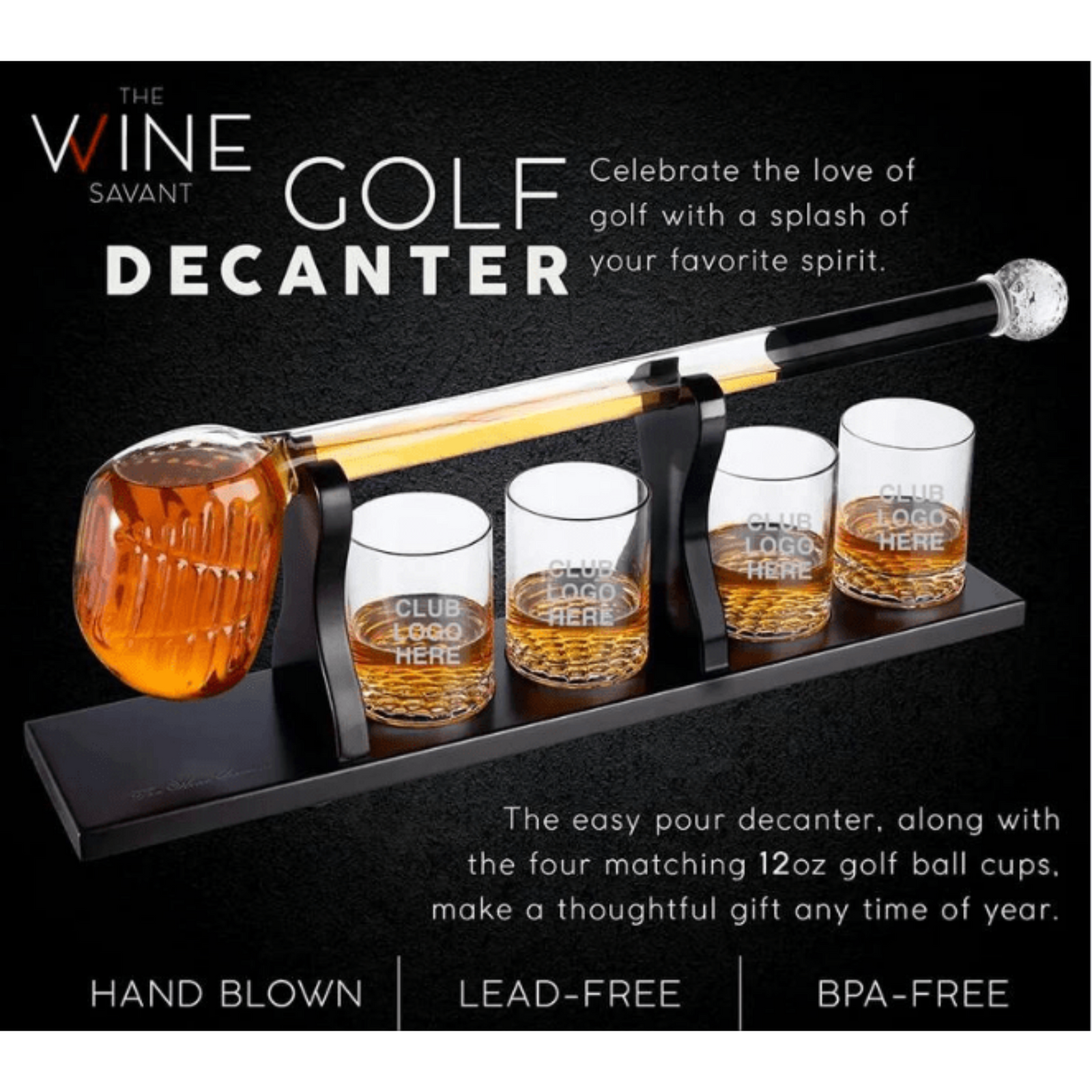 Golf club decanter set with four matching 12oz golf ball rocks glasses, sample engraving reading "CLUB LOGO HERE" on glasses, displayed on black base with hand-blown decanter filled with amber spirit