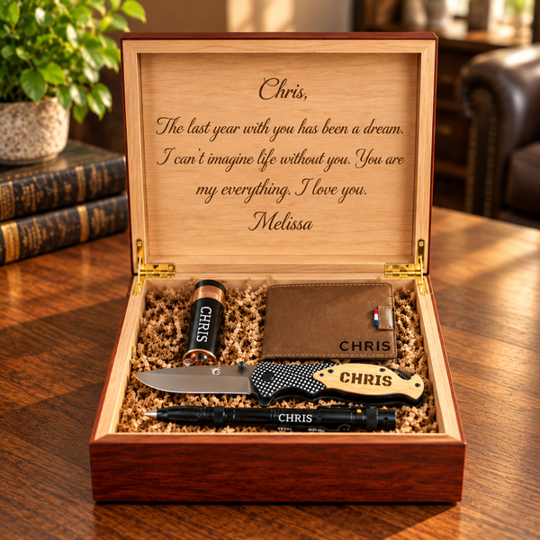 Open wooden box engraved with personal message containing engraved flask, lighter, and knife with personalized name samples on each item