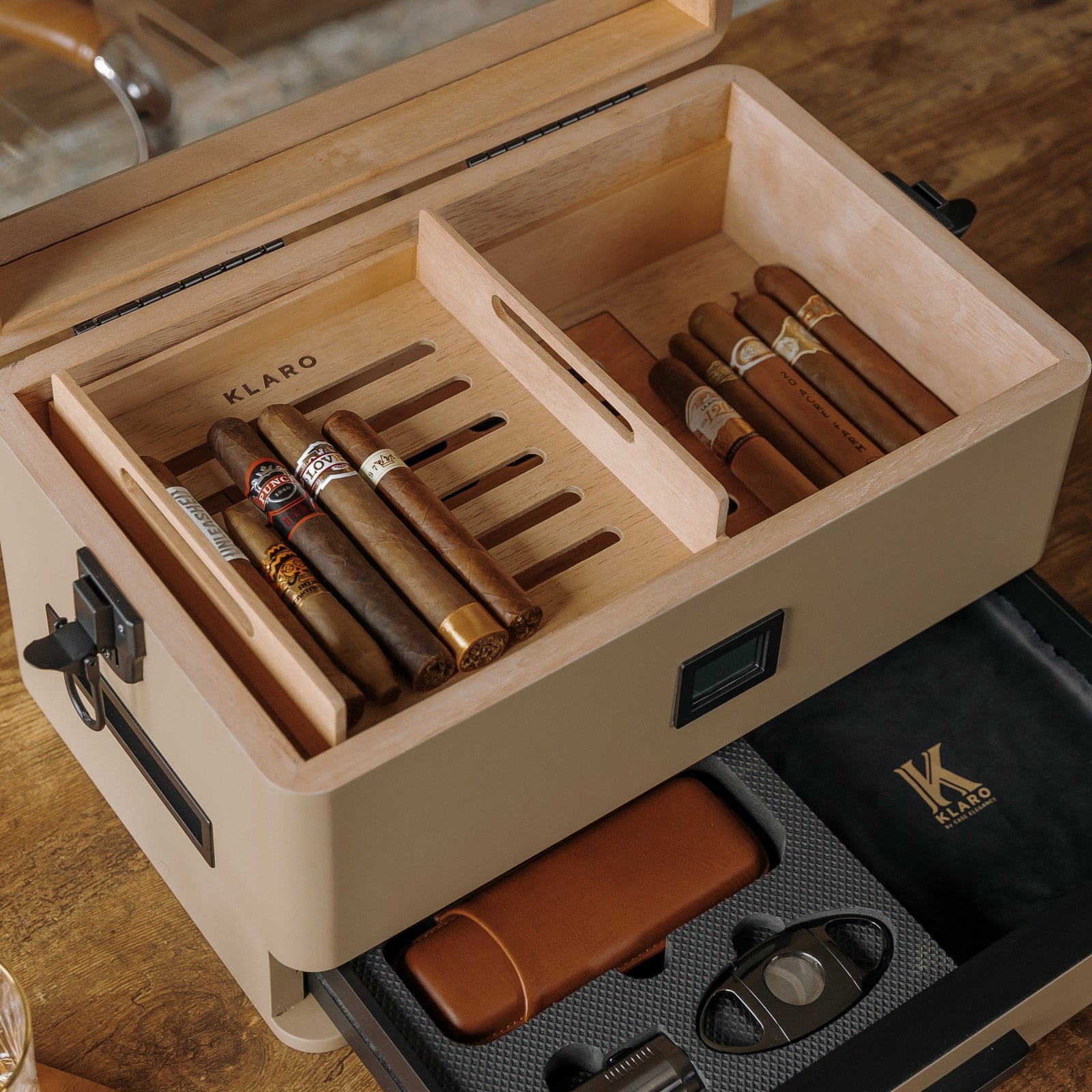 Coyote tan military cigar humidor with Spanish cedar lining, black corner guards, and storage drawer.