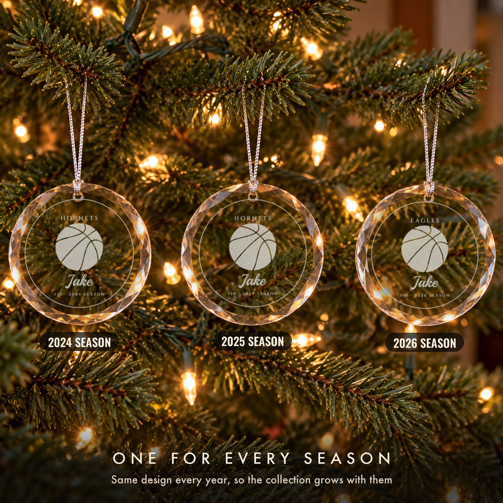 Three personalized basketball Christmas ornaments in a row on a tree, the same design every season, engraved Jake #10 for 2024, 2025 and 2026