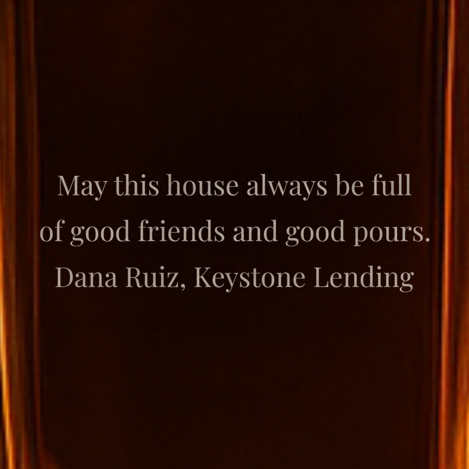 Close-up of a back note engraved on a gift for new homeowners from their lender: May this house always be full of good friends and good pours