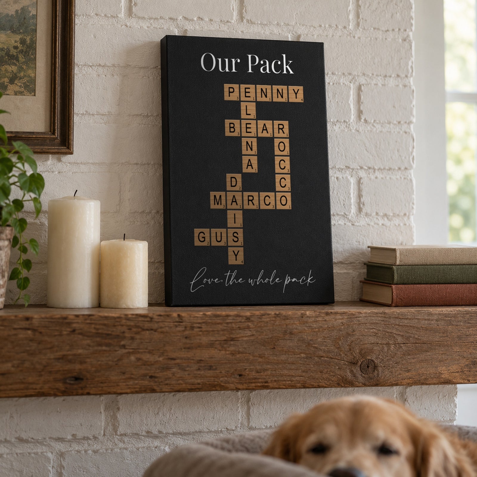 Our Pack crossword name wall art leaning on a fireplace mantel, dog names Rocco, Daisy, Penny, Bear and Gus linked in a family crossword puzzle