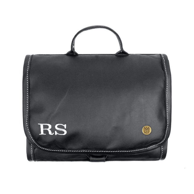 Full grain leather hanging wash bag with waterproof lining and multiple compartments for men.
