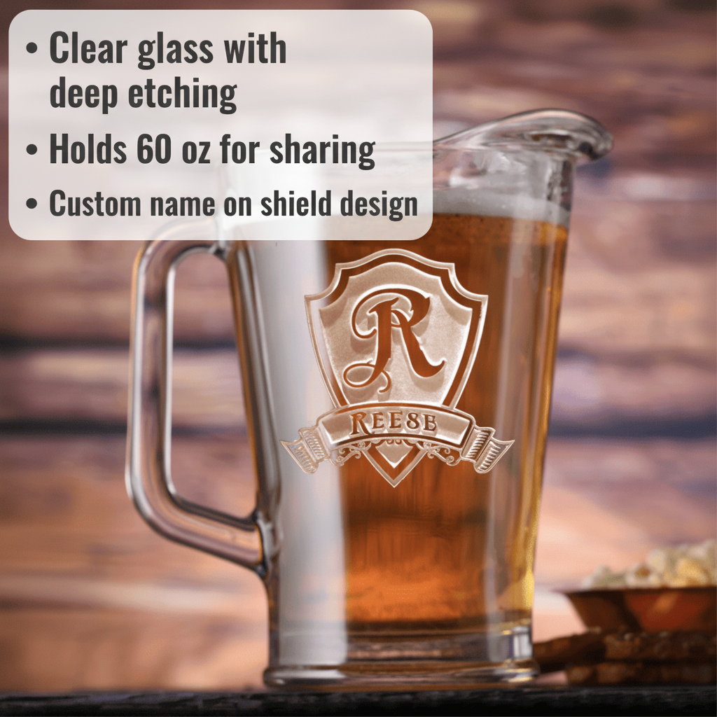 60 oz clear glass beer pitcher with deep-etched shield crest design featuring sample name "REESE" in personalized banner, filled with amber liquid