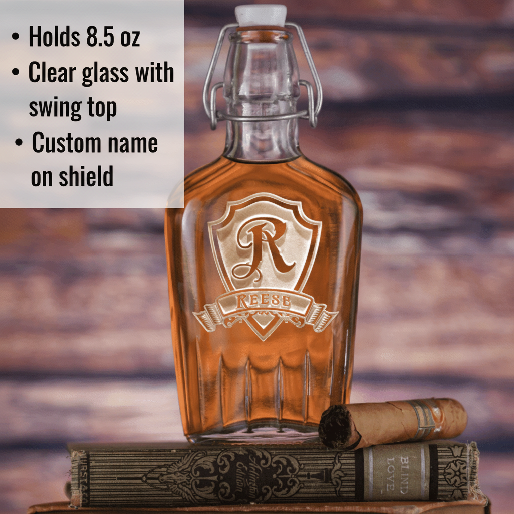 Clear glass flask with swing-top closure, engraved with sample shield crest design and personalized name banner "REESE" in script lettering