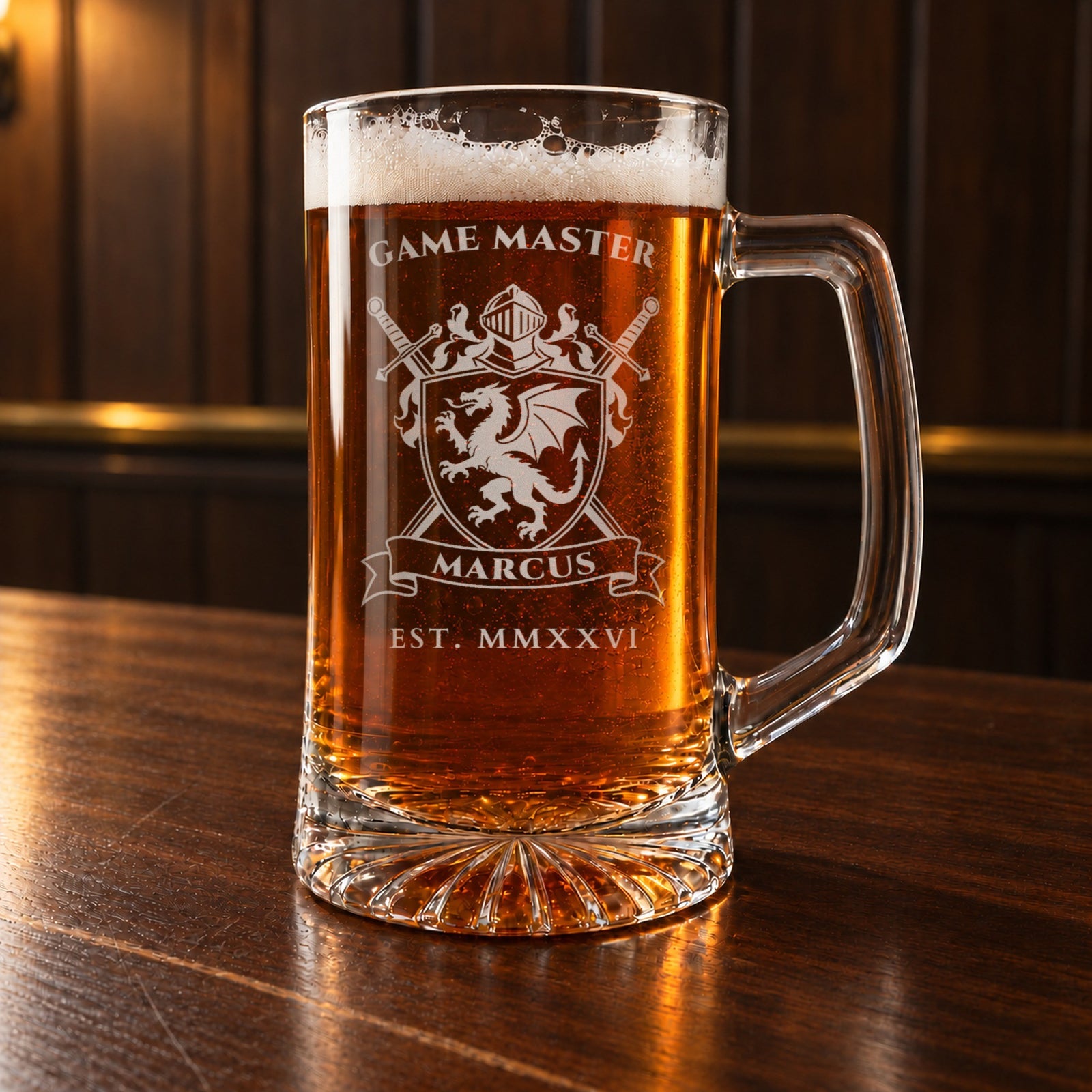 Game master gift for a tabletop gamer: a personalized 25 oz glass beer mug on a walnut bar, engraved with a dragon crest, GAME MASTER, MARCUS and EST. MMXXVI