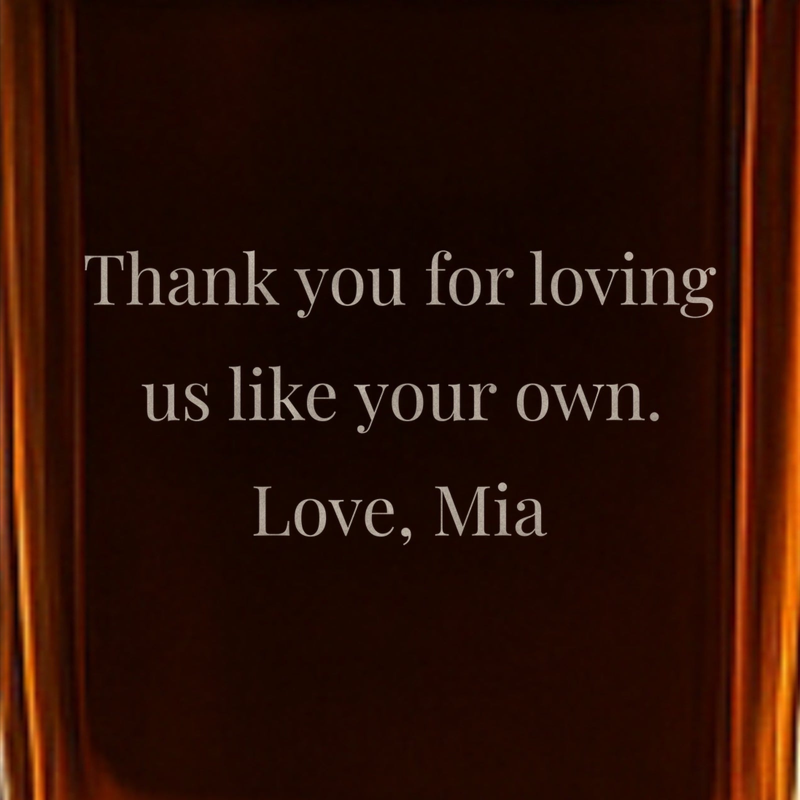 Close-up of a back note on a gift for stepdad from his kids, frosted into the glass: Thank you for loving us like your own. Love, Mia