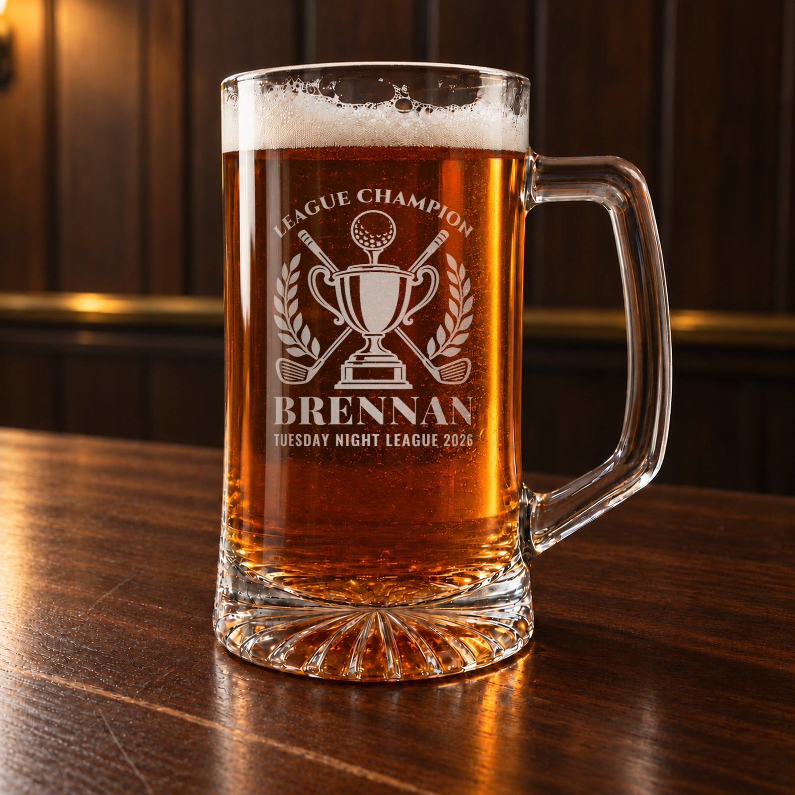 Golf league champion beer stein on a bar, engraved with a trophy, golf ball and crossed clubs, League Champion, Brennan and Tuesday Night League 2026
