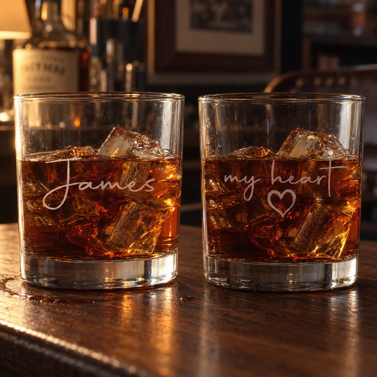 My Heart personalized whiskey glass with James etched in script on the front and my heart with a small heart on the back, bourbon on ice