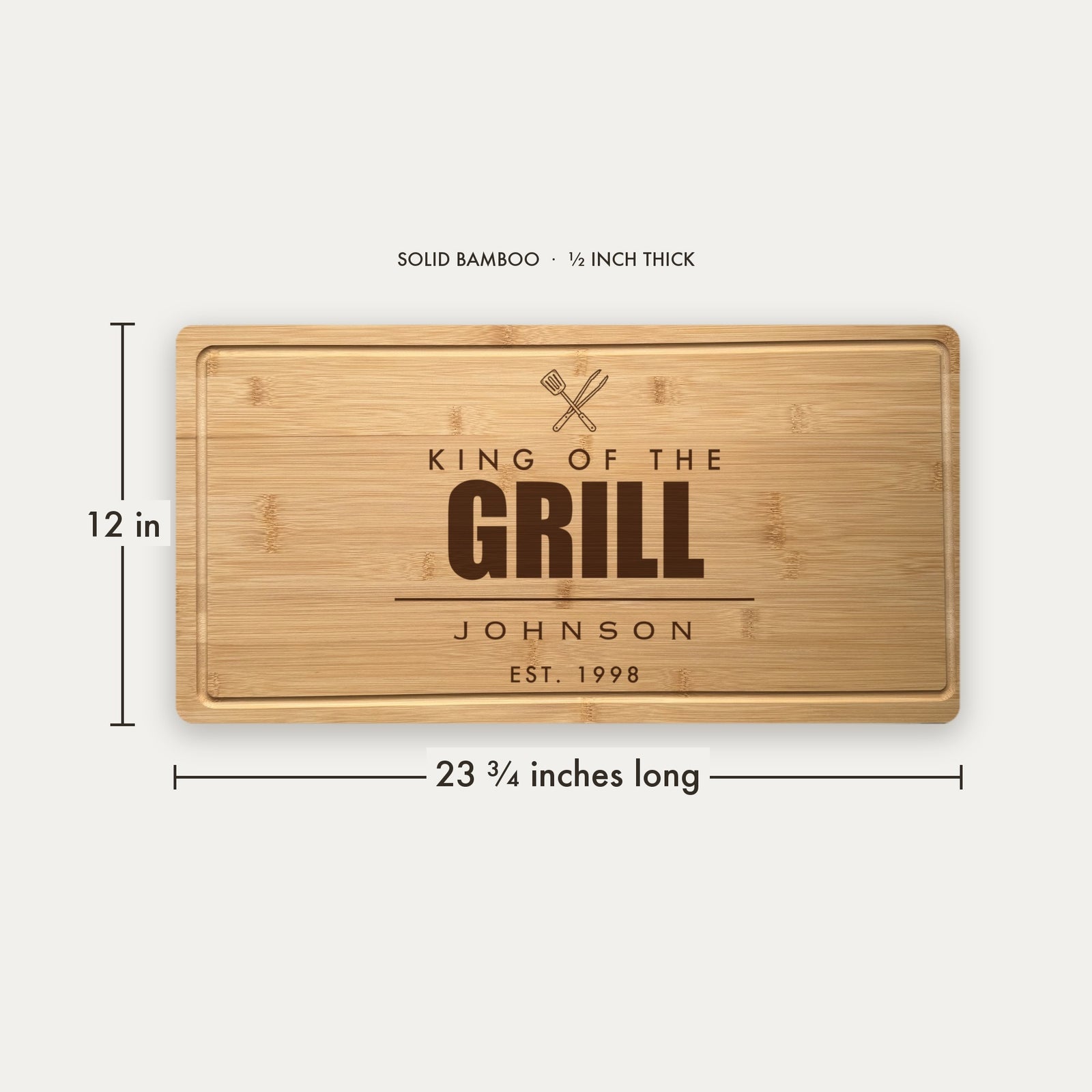 Size guide for the personalized BBQ cutting board, 23 and three quarter inches long by 12 inches wide in half inch thick solid bamboo.
