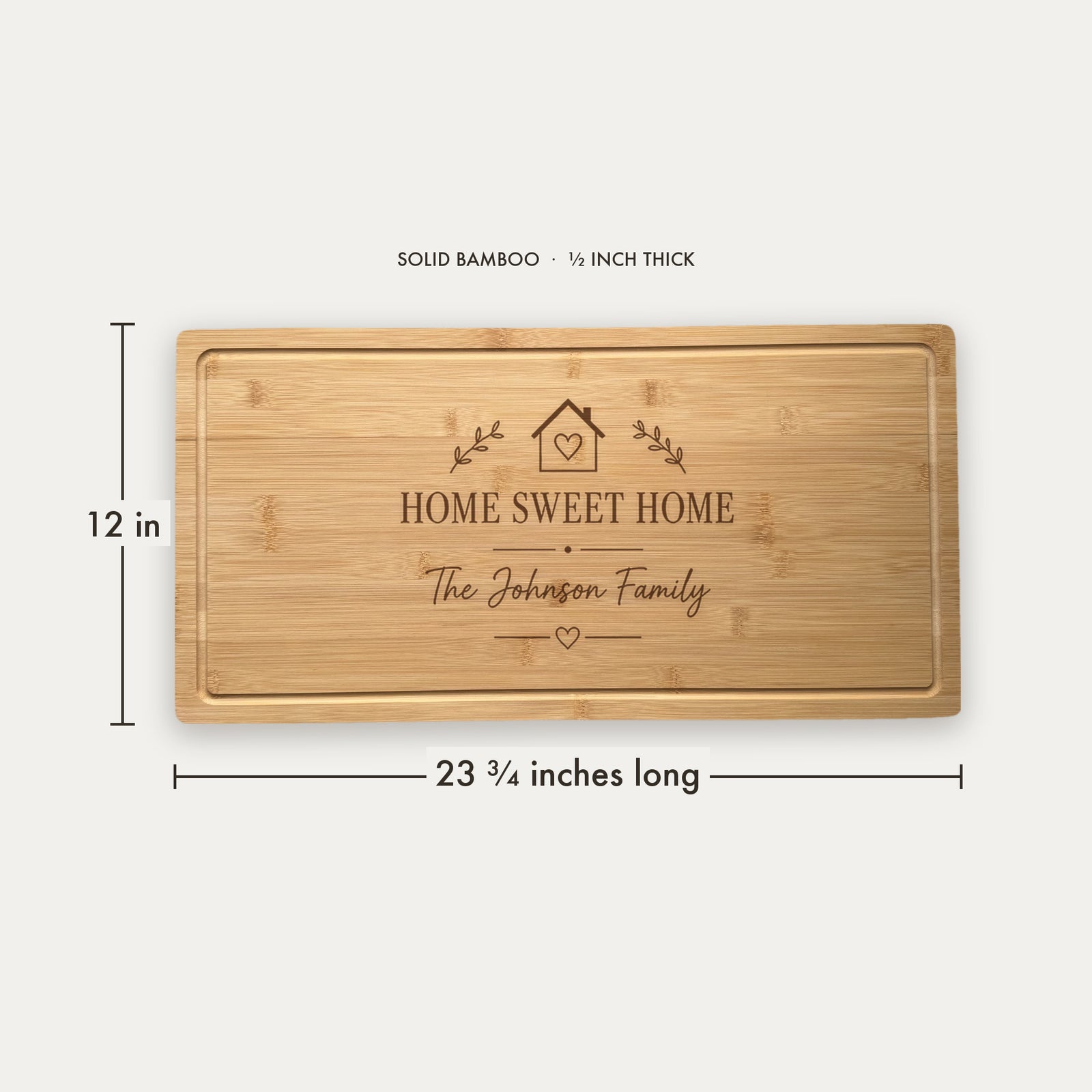 Size guide for the personalized housewarming cutting board, 23 and three quarter inches long by 12 inches wide in half inch thick solid bamboo.