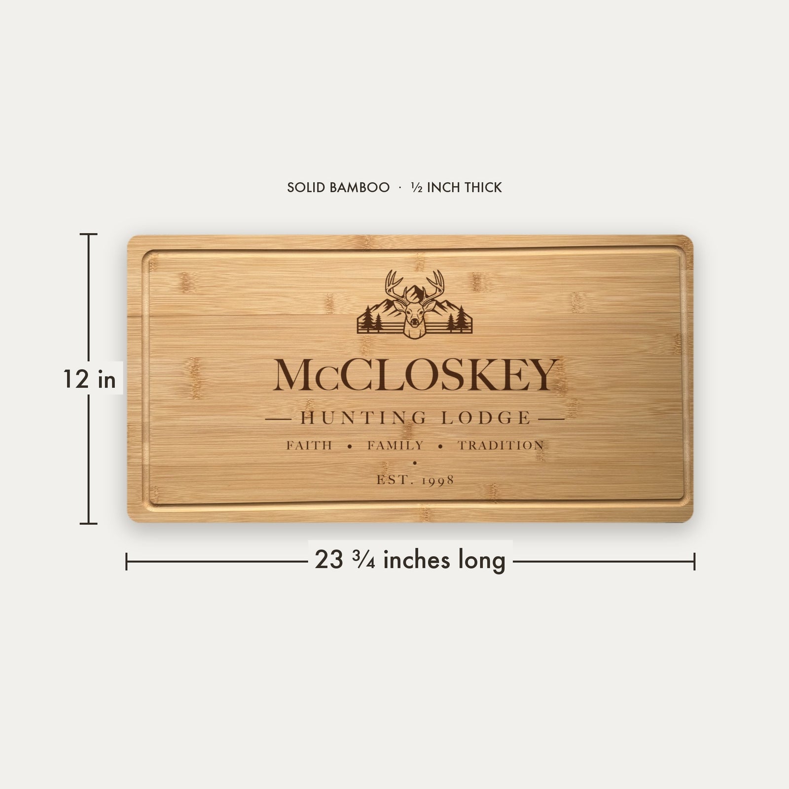 Size guide for the personalized hunting lodge cutting board, 23 and three quarter inches long by 12 inches wide in half inch thick solid bamboo.