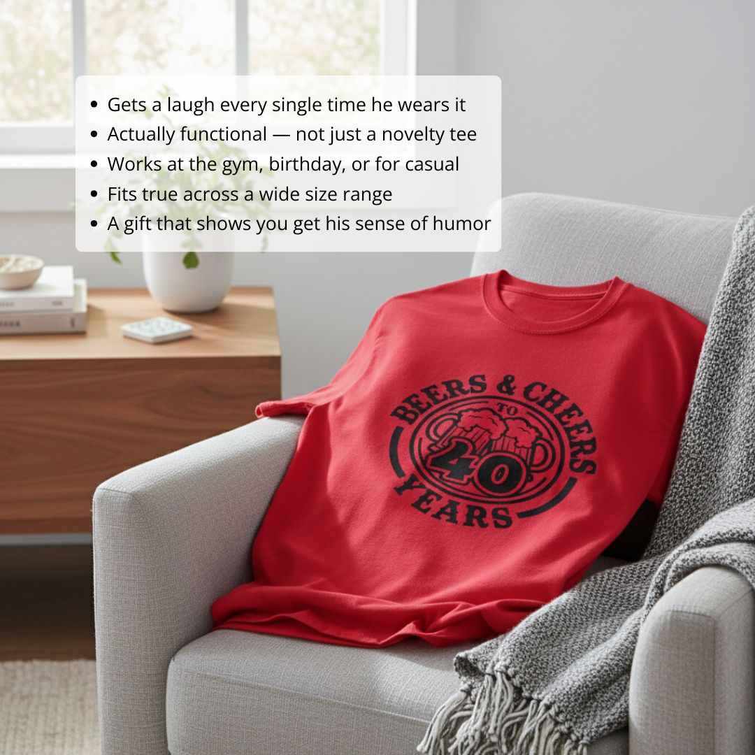 Red cotton t-shirt with black printed graphic reading "Beers & Cheers to 40 Years" in circular badge design, displayed on gray armchair