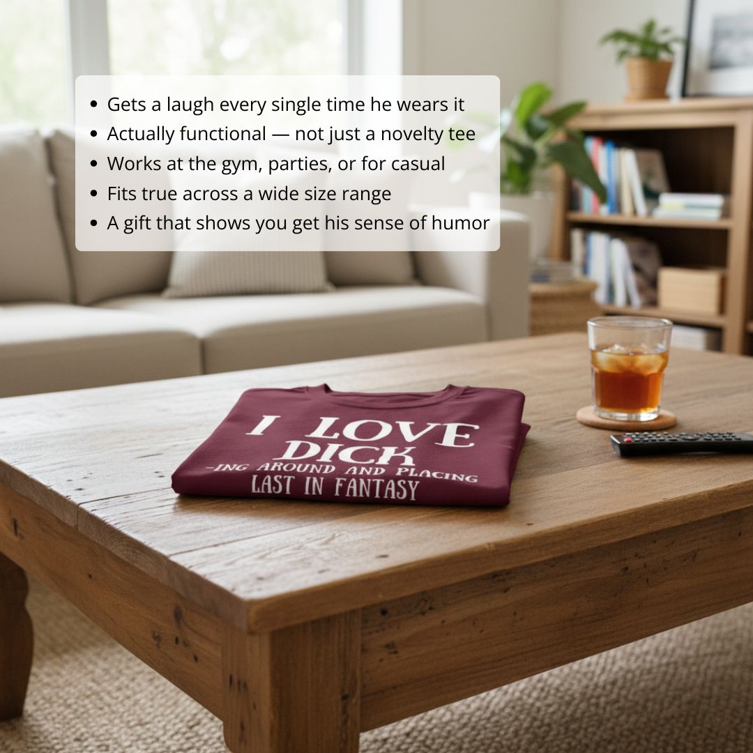 Burgundy t-shirt with white text reading "I LOVE DICK" and smaller text about fantasy football, displayed folded on a wooden table