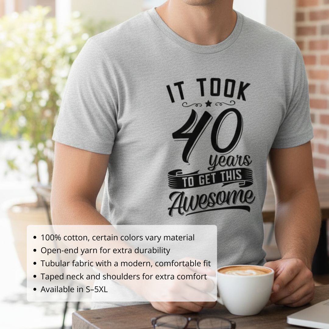 Light gray t-shirt with black printed graphic reading "It took 40 years to get this awesome" with decorative flourishes and star accent