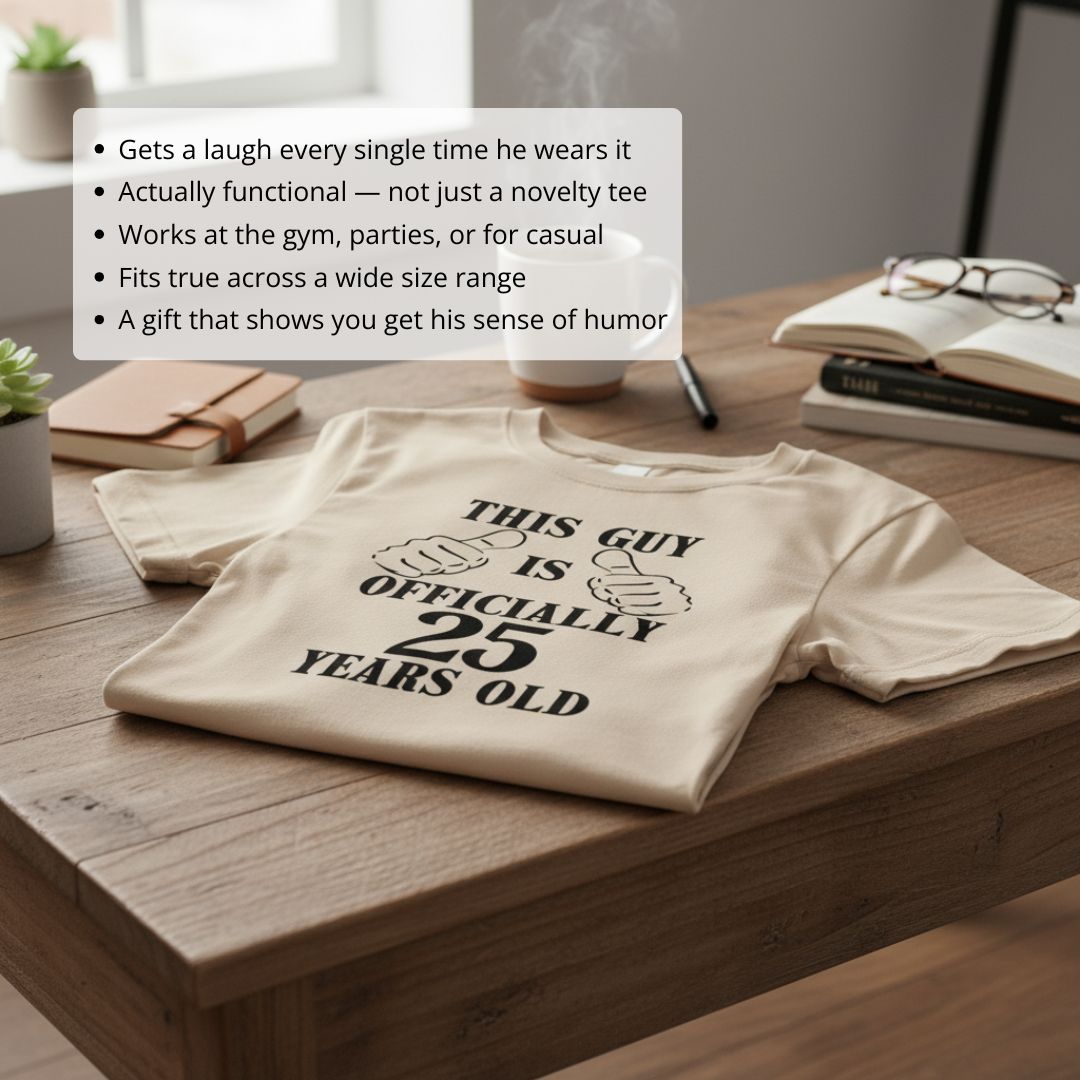 Cream-colored t-shirt laid flat on wooden desk, printed with "This Guy is Officially 25 Years Old" text and thumbs-up graphic design