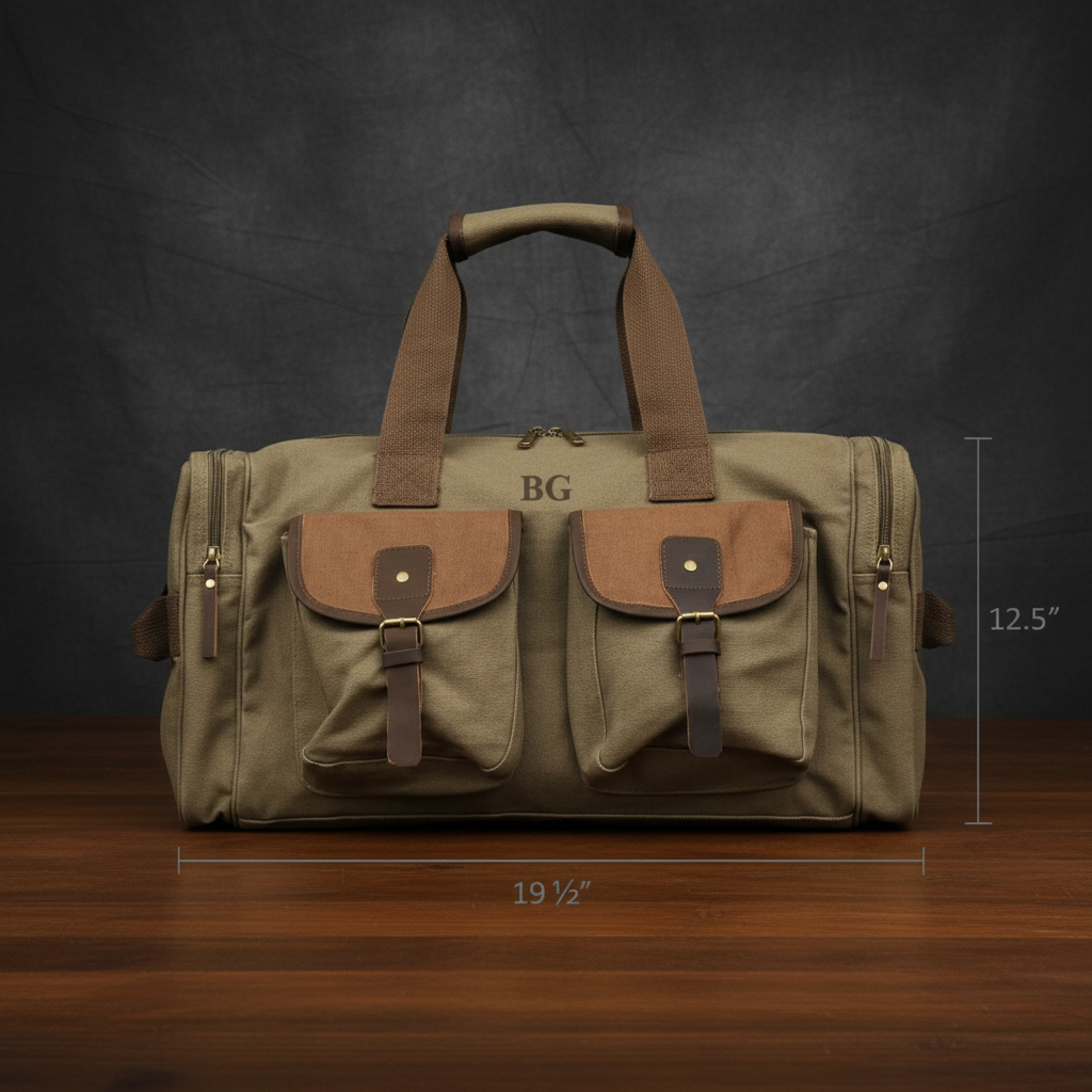 Canvas weekender duffle with sample initials "BG" engraved on top, tan canvas body with cognac leather front pockets, brass hardware, and tan carry handles, displayed with dimensions 19.5" by 12.5