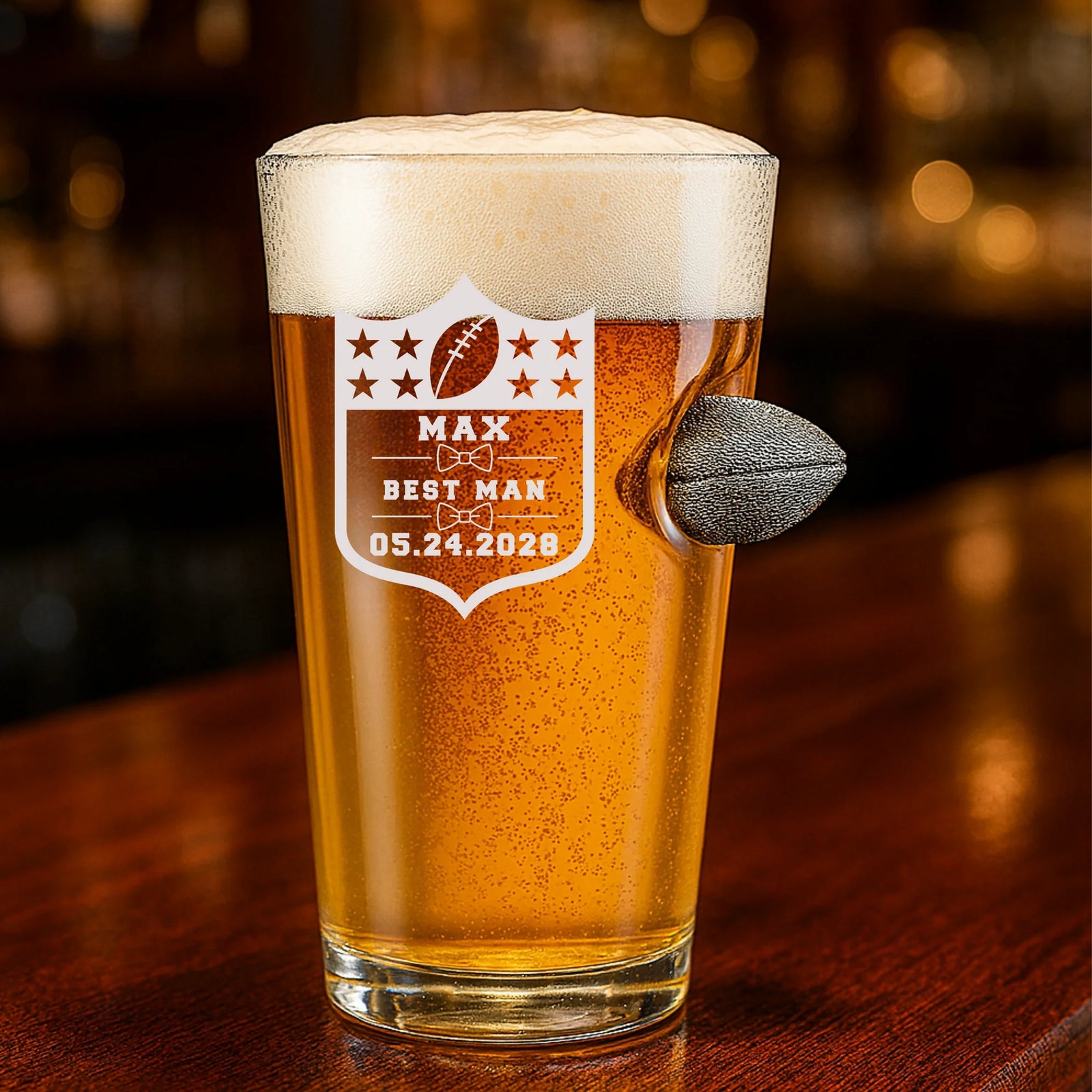 Custom football-themed groomsmen pint glass with engraved name, role, and wedding date