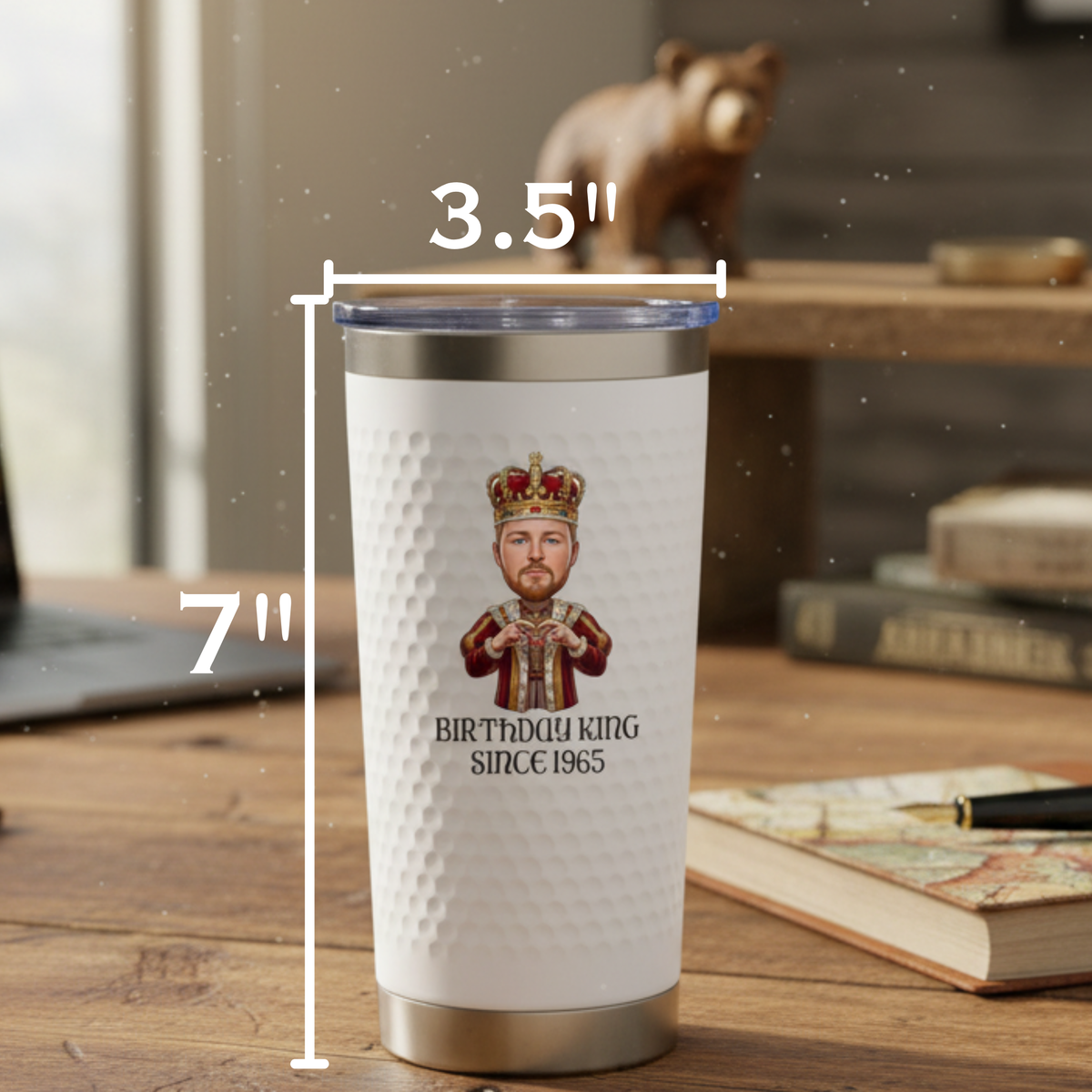 White insulated tumbler with stainless steel base and lid, printed with cartoon king illustration and "Birthday King Since 1965" text, shown with dimensions 7" height and 3.5" diameter