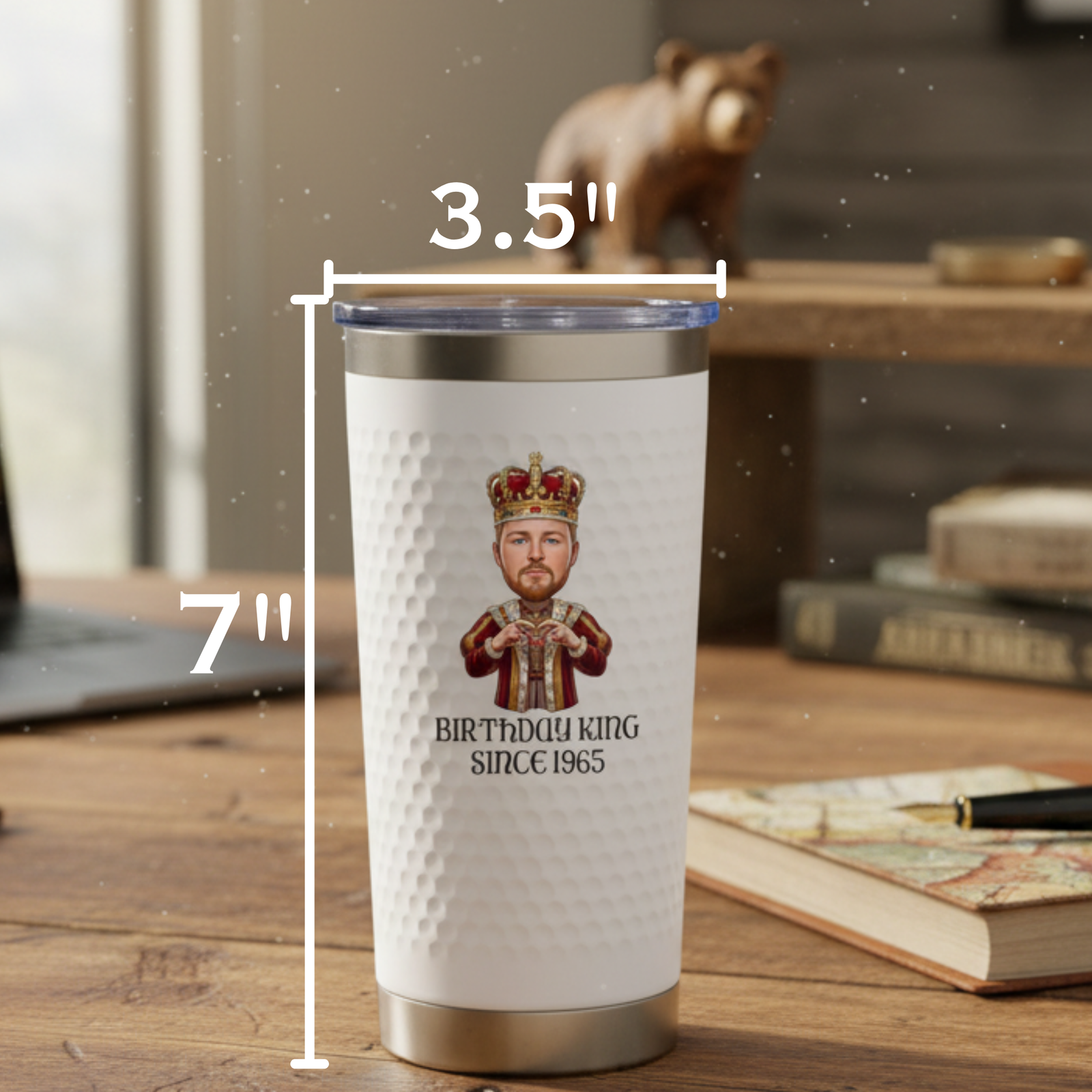 White insulated tumbler with stainless steel base and lid, printed with cartoon king illustration and "Birthday King Since 1965" text, shown with dimensions 7" height and 3.5" diameter