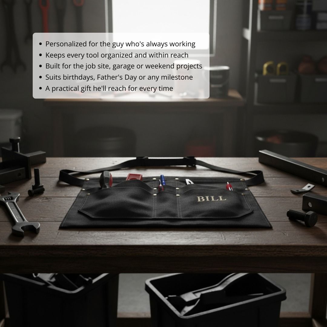 Black canvas tool belt with sample personalization "BILL" embroidered in gold lettering, displayed flat on workbench surrounded by various hand tools and hardware.