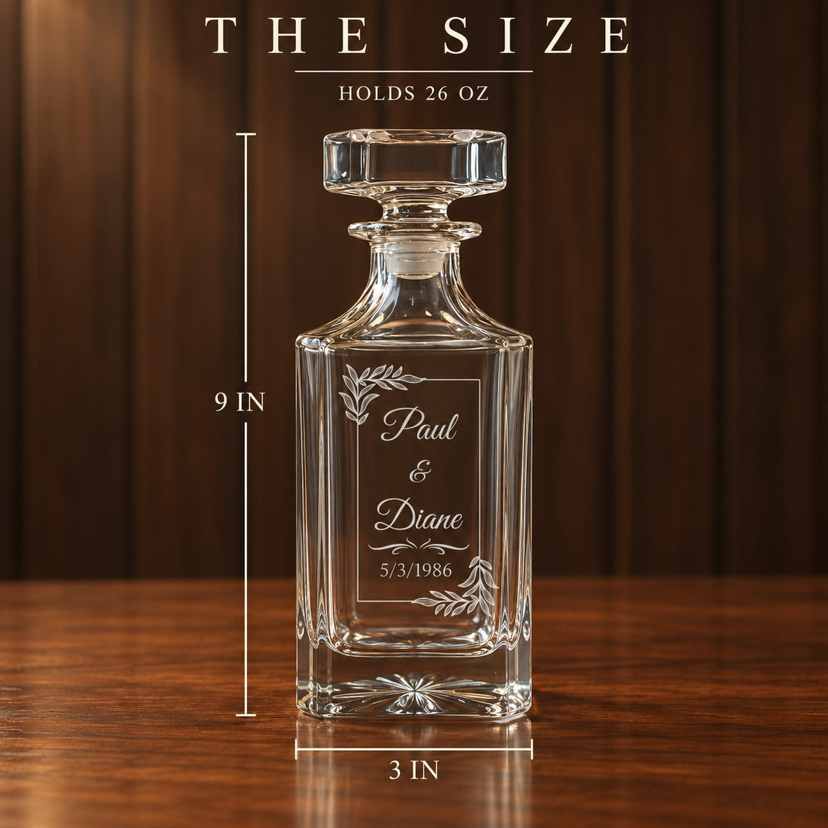 Size of the personalized whiskey decanter, 9 inches tall with a 3 inch base and holds 26 oz, engraved with a couple's names and 1986 wedding date