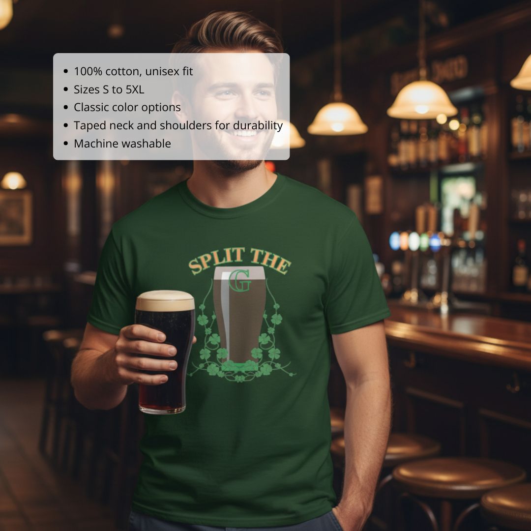 Man wearing forest green t-shirt with "Split the G" graphic featuring beer pint and clover design, holding dark stout in bar setting