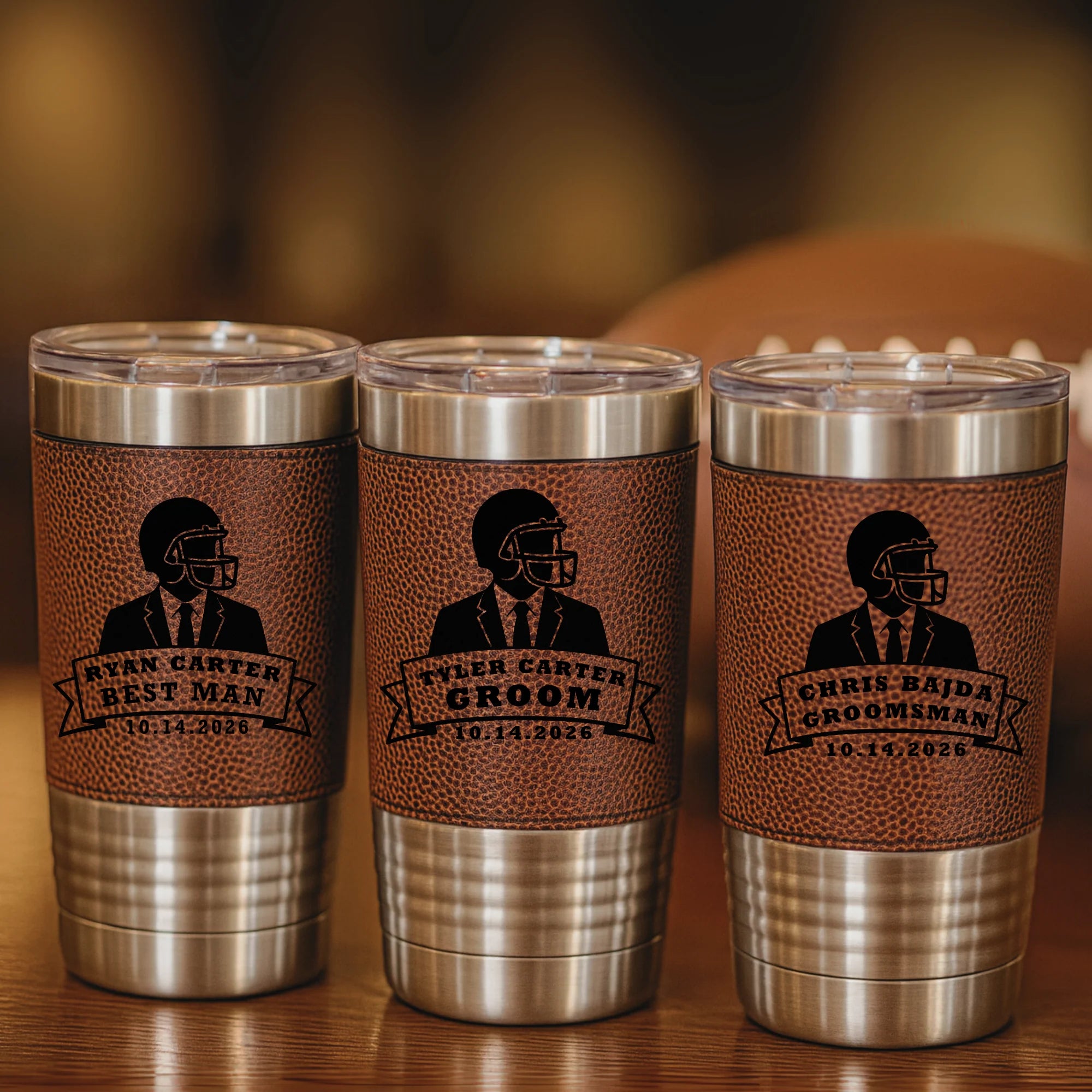 Personalized football tumbler with engraved name, groomsman role, and wedding date on faux leather wrap