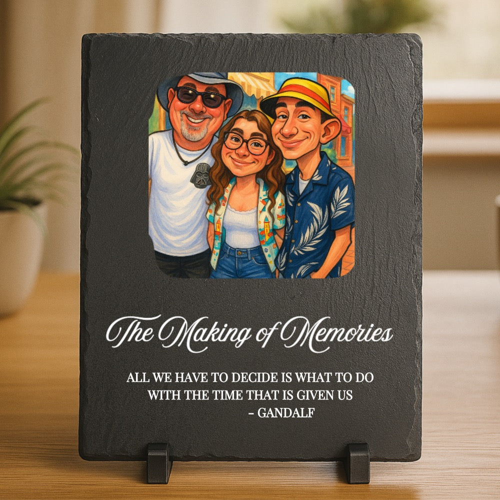 Slate plaque with custom caricature illustration of three people and engraved text "The Making of Memories" with Gandalf quote, displayed on wooden stand
