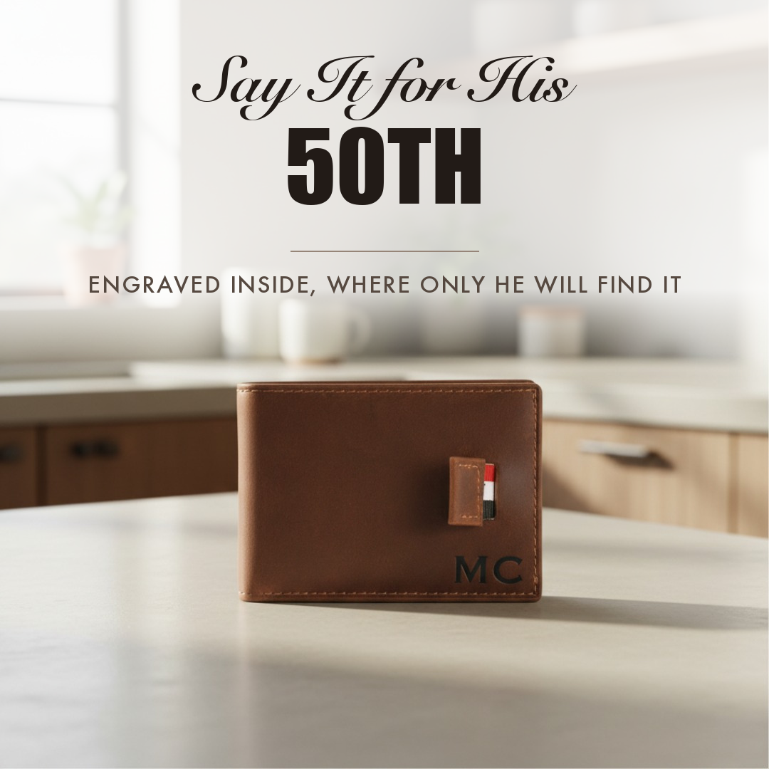 Brown leather bifold wallet engraved with initials, captioned Say It for His 50th, shown as a personalized 50th birthday gift for him.