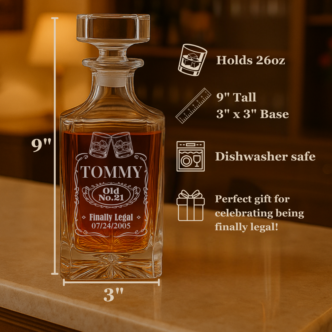 Whiskey decanter engraved with sample personalization reading "TOMMY Old No. 21 Finally Legal 07/24/2005" shown filled with amber liquid on wooden surface