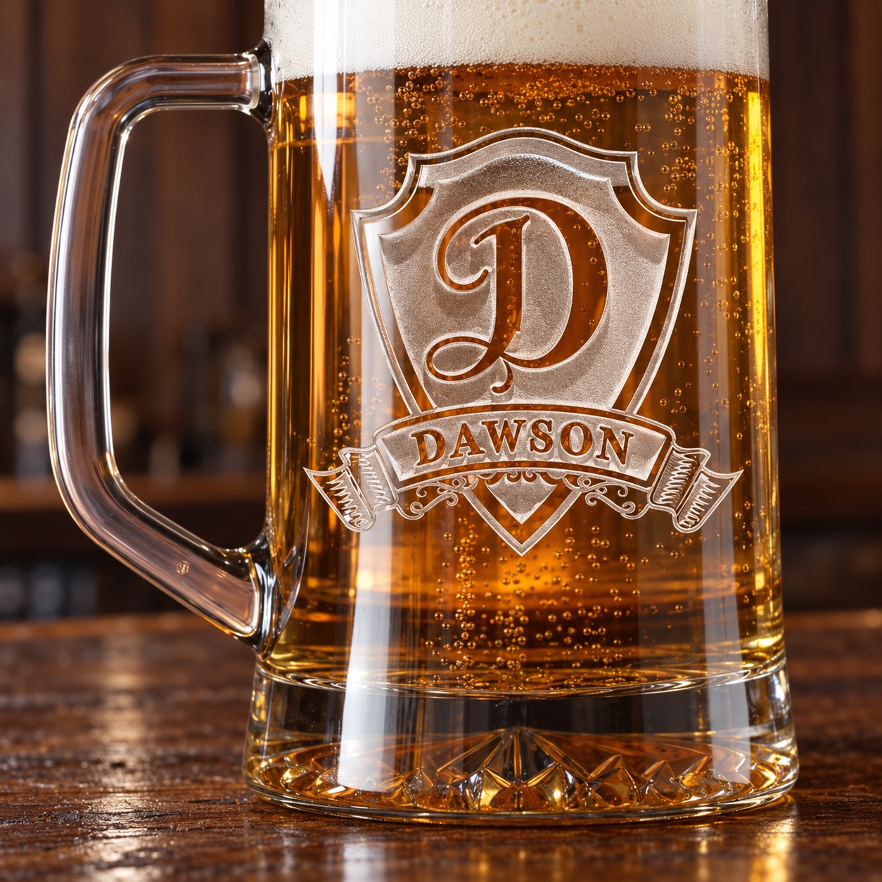 Close-up of the sand-carved shield on a personalized beer mug, a large D initial and the name DAWSON on the ribbon banner with lager behind it.