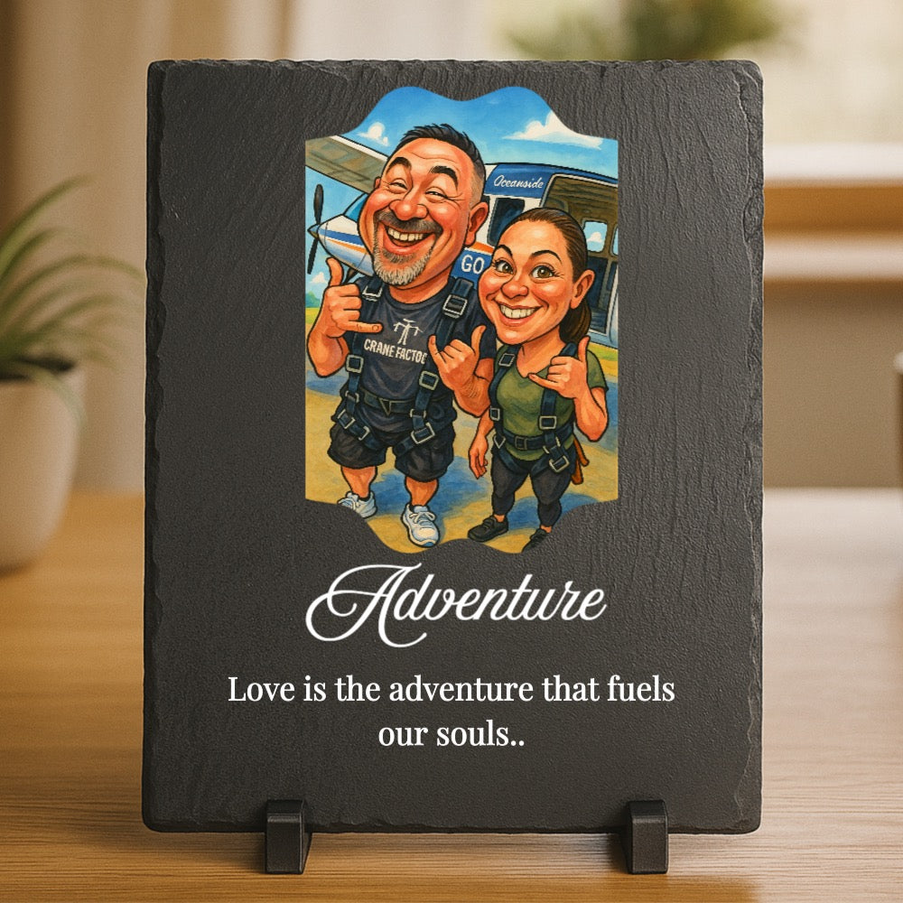 Slate plaque with custom caricature of two people skydiving, printed with sample text "Adventure" and "Love is the adventure that fuels our souls