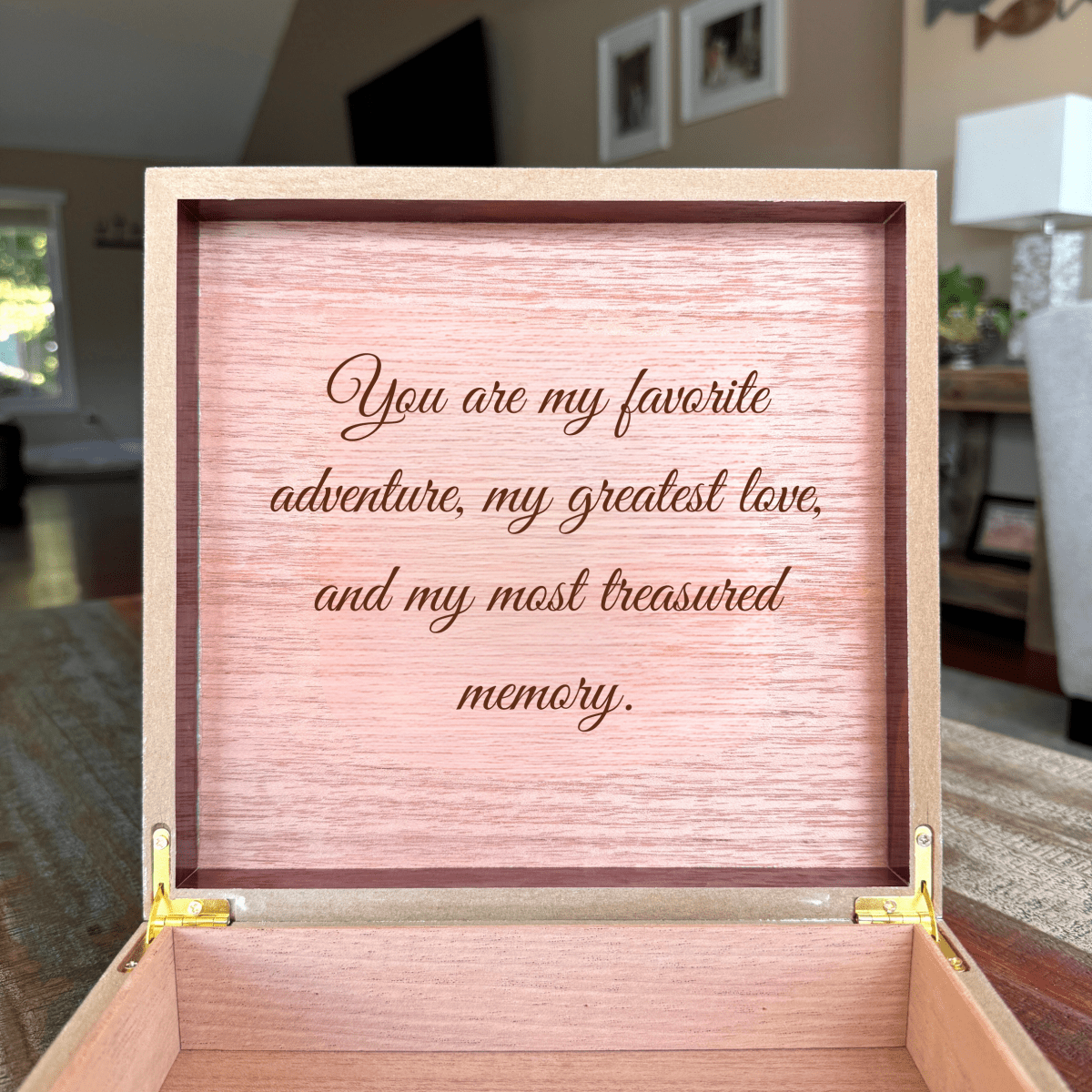 Open personalized keepsake box in a living room with a custom engraved message, an 80th birthday gift