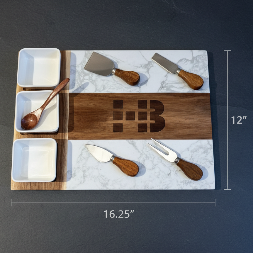 Dimension view of the custom logo charcuterie board showing the 16.25 by 12 inch marble and acacia surface with an engraved sample logo and serving utensils.