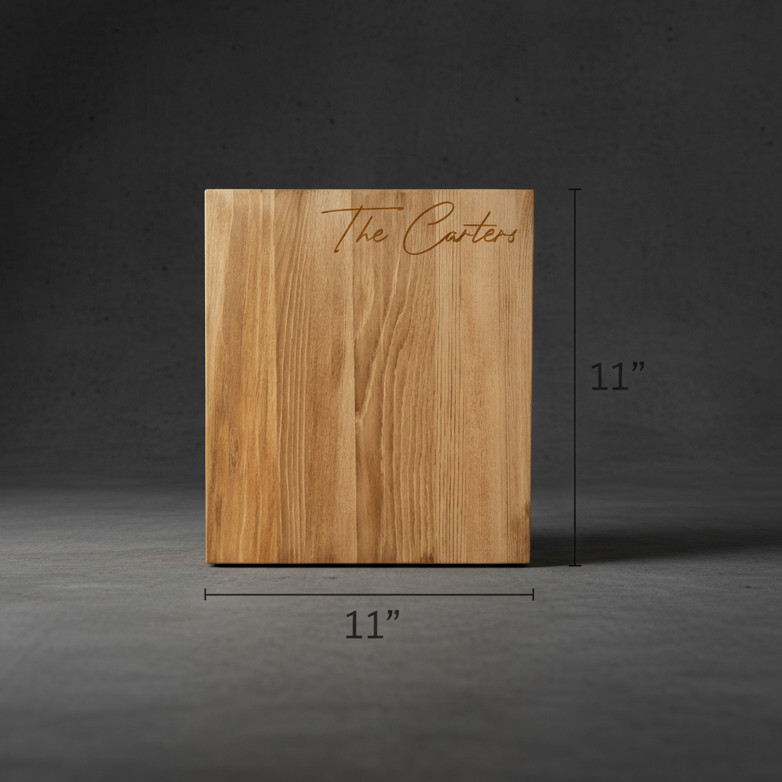 Natural wood cutting board engraved with sample text "The Carters" in script, measuring 11 inches square