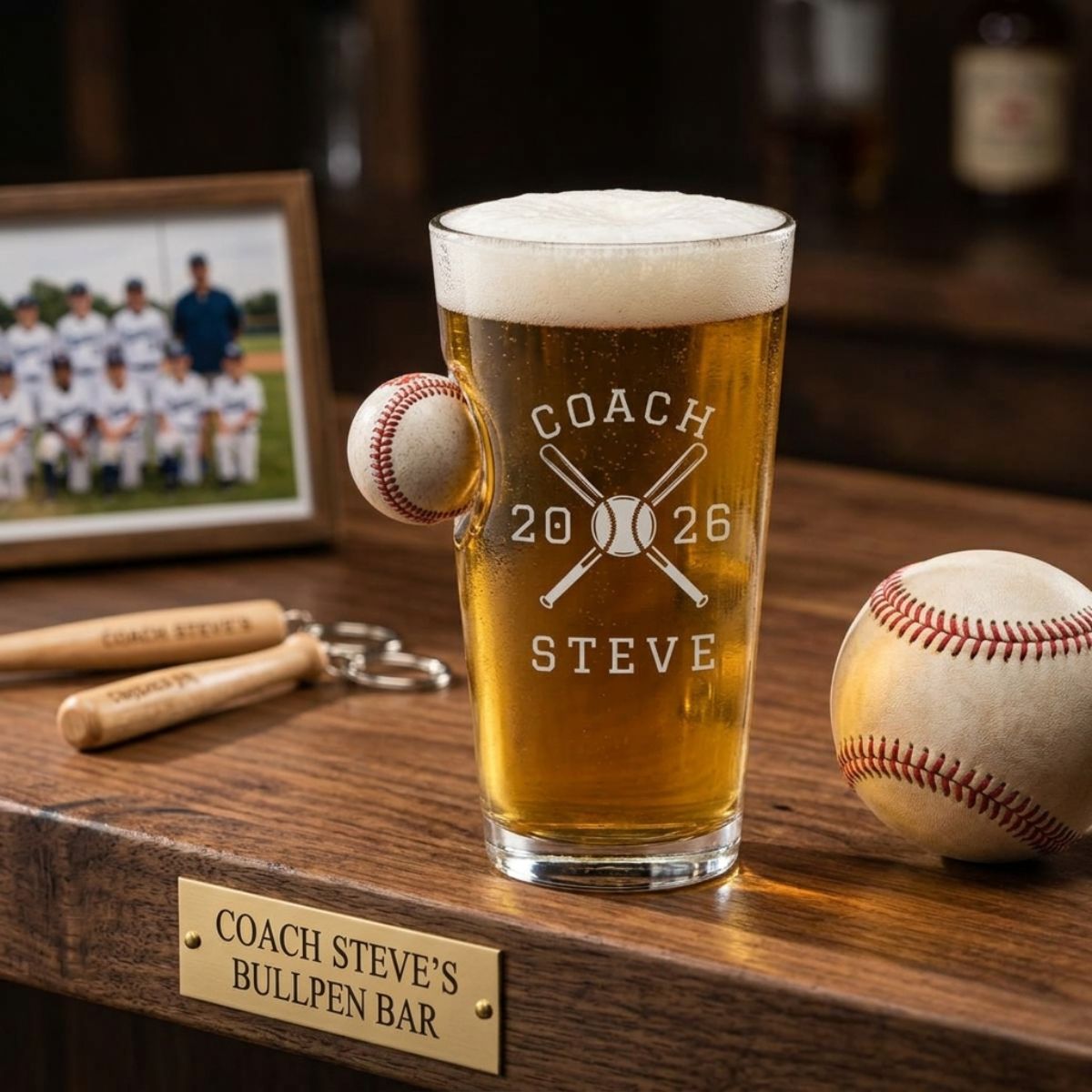 Personalized baseball coach gift pint glass engraved with crossed bats, the word COACH, the coach's name and year, and the team's full player roster on the back.